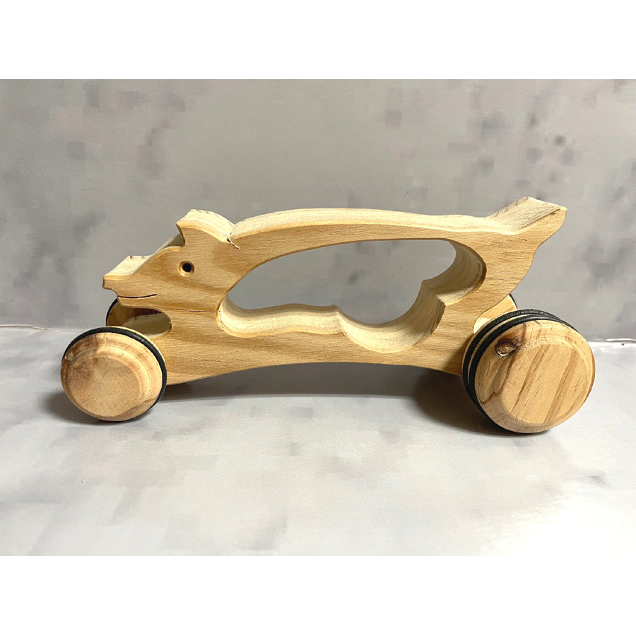 Pig on wheels with handle