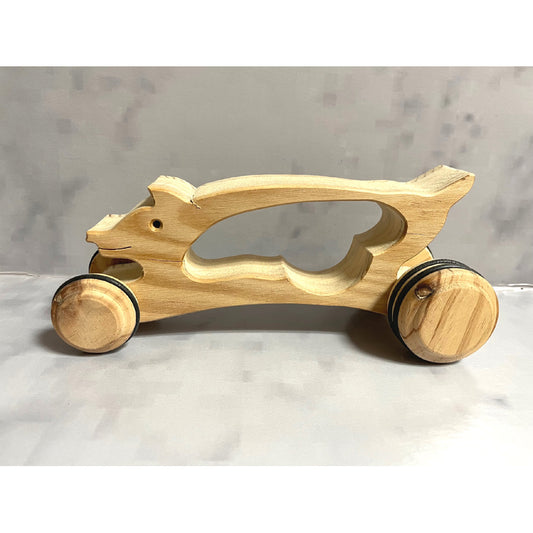 Pig on wheels with handle
